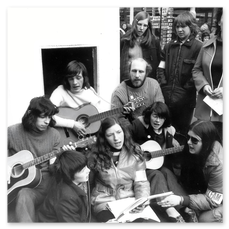 Denise playing guitar in Mansfield at an Oxfam demonstration